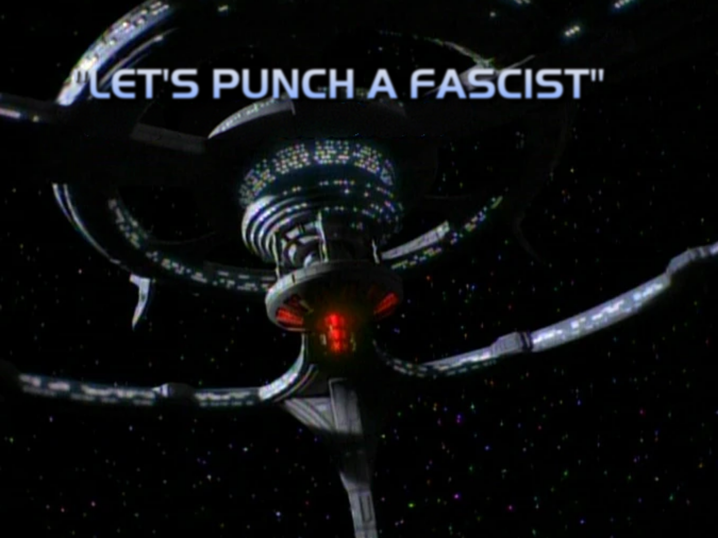 Looking up the skirt of that Fascist Cardassian Eyesore, you can see the red lights on the bottom of the center section, the docking and habitat rings, and some nice pylon action behind the center of the station. Title is very On Brand™ for Star Trek: "Let's Punch a Fascist".